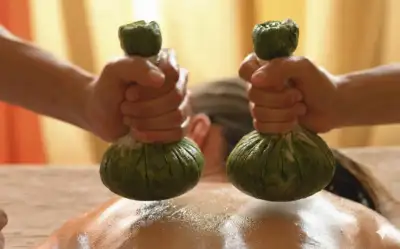 Elakizhi herbal leaf bolus massage treatment for pain relief at Keraliyaas Madhapur Hyderabad