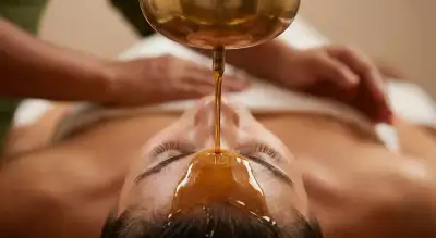 Shirodhara warm medicated oil pouring therapy at Keraliyaas Madhapur Hyderabad